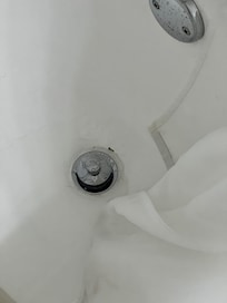 Chips around the drain