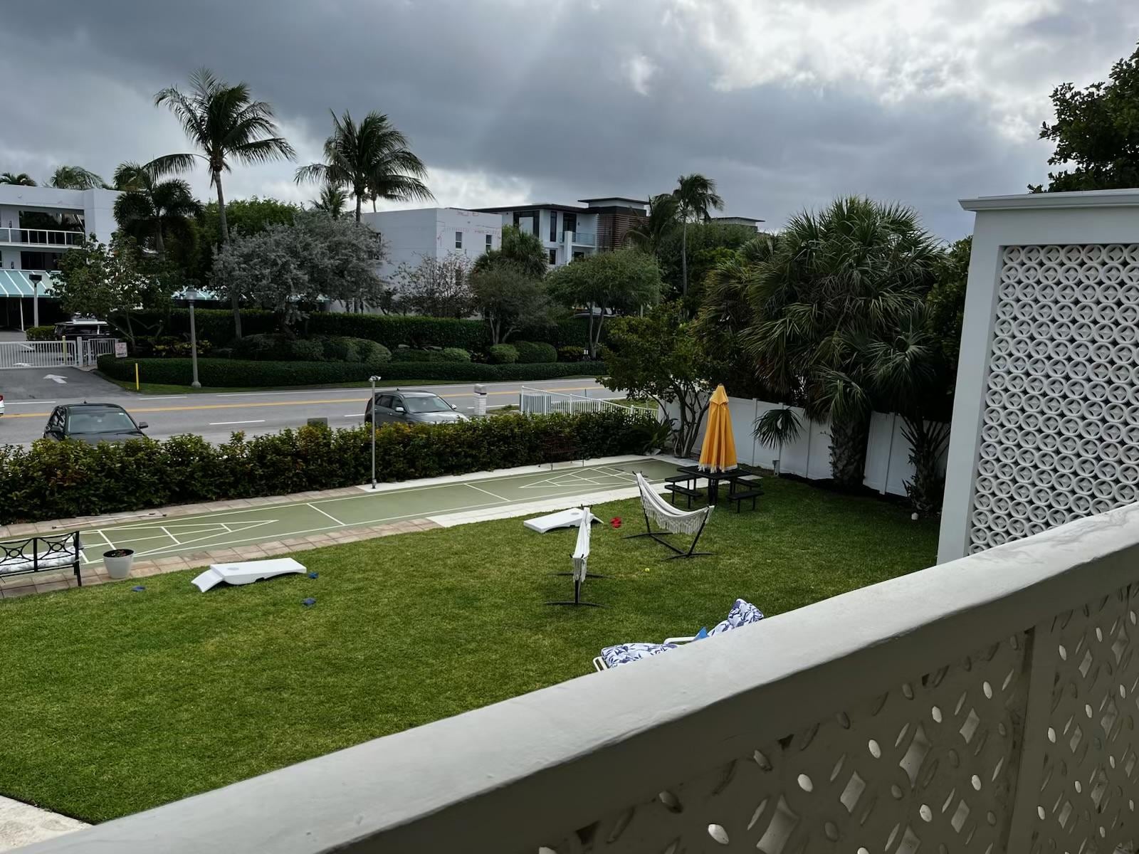 Courtyard shuffleboard, chairs, hammocks, cornhole