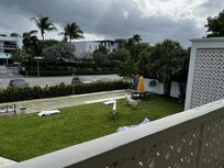 Courtyard shuffleboard, chairs, hammocks, cornhole