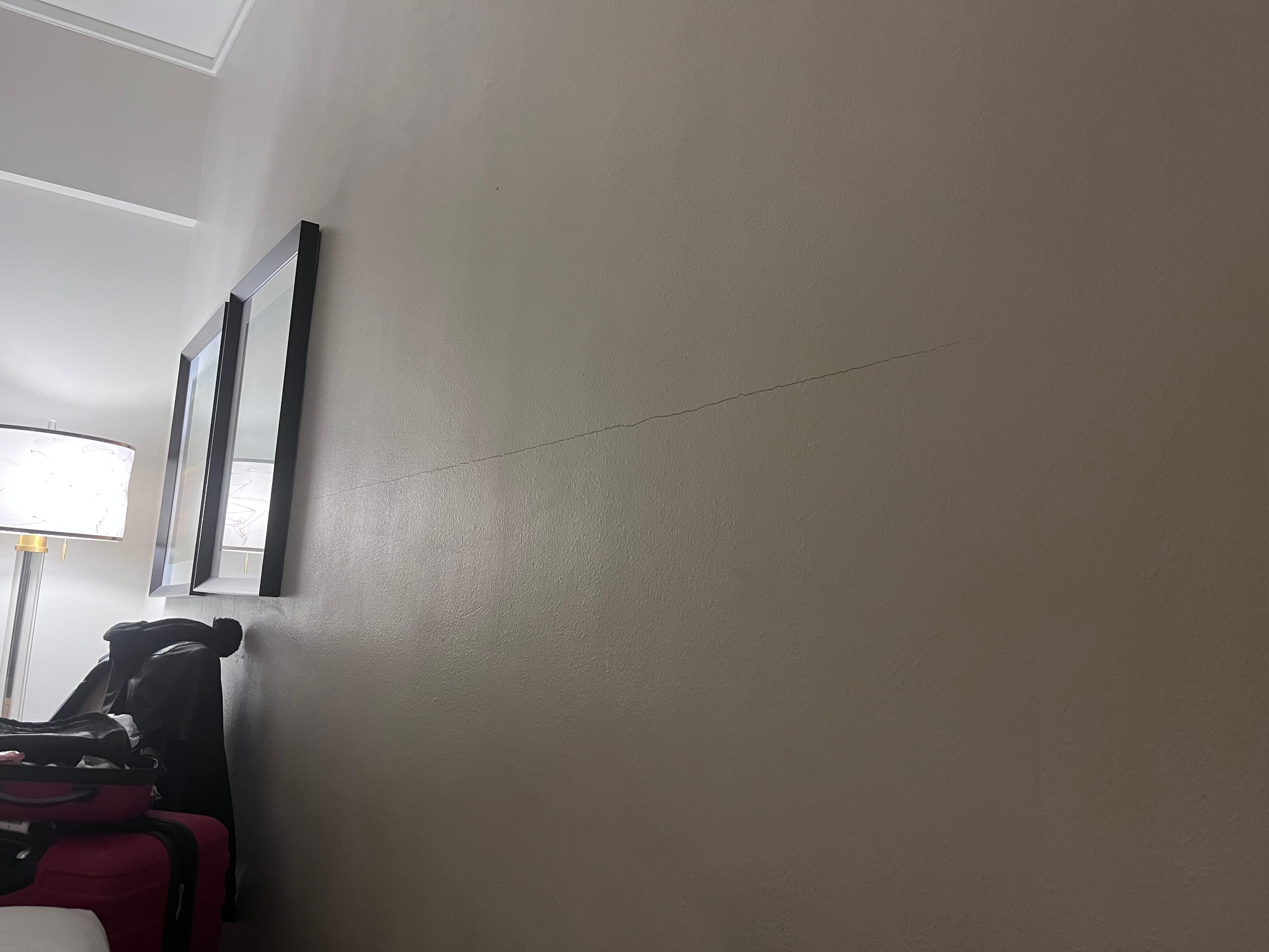 Crack across the wall.  The opposite side of the room had hooks where a picture used to be.