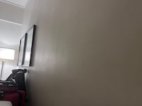 Crack across the wall. The opposite side of the room had hooks where a picture used to be.