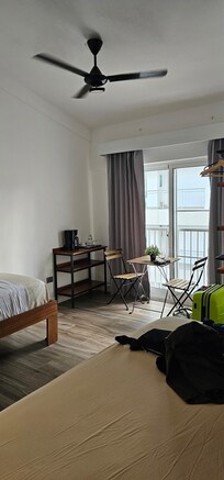 Hotel room - view of the table and chairs next to the windows.