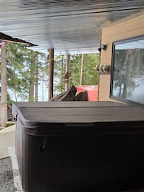 Camera pointing at hot tub which is on hosts bottom deck area