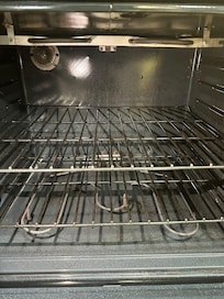 Oven with spill stains in it