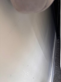 Dust and grime behind the bed