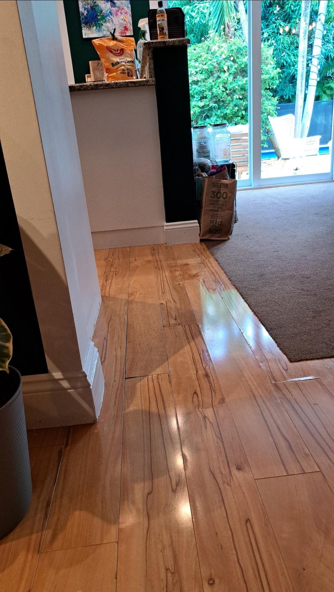 Floor buckled from previous leak.  Informed Kitchen will be remodeled.