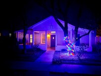 We visited after Xmas and really loved the simple string of lights because the street was dark at night (tho very safe). I think a nice set of warm white string lights would be nice year-round for ambience.