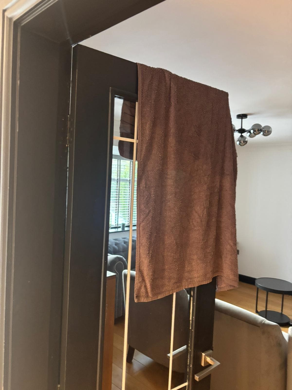 Wet towels hung over doors