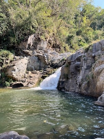 The waterfall where you can take a dip