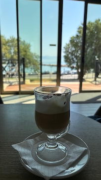 Enjoying my latte while waiting for the airport shuttle