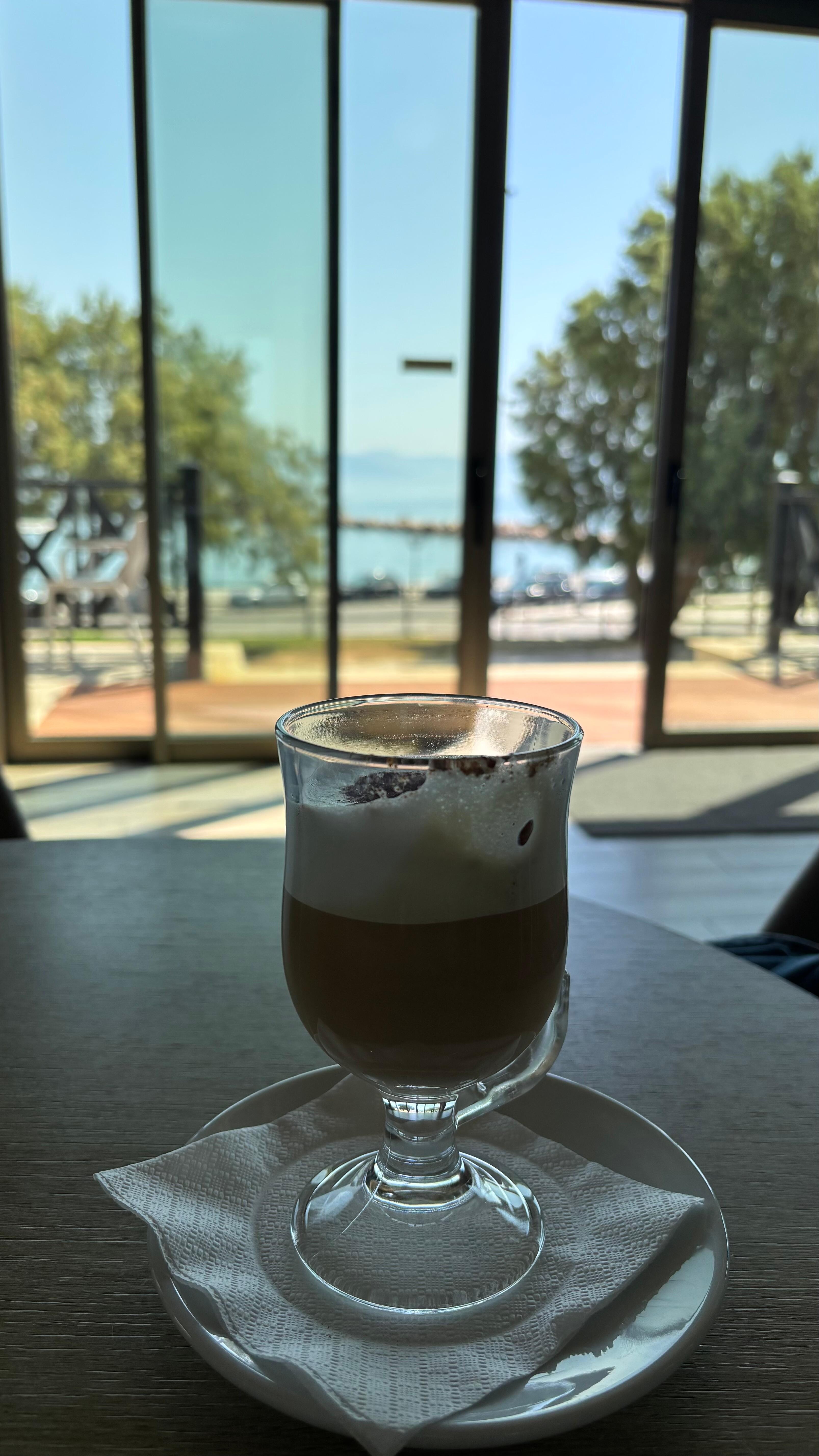 Enjoying my latte while waiting for the airport shuttle