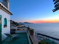 Dinner on the balcony of Villa Capriccio at sunset