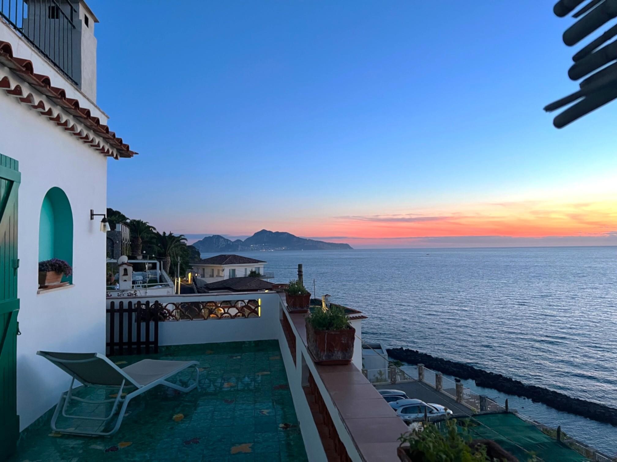 Dinner on the balcony of Villa Capriccio at sunset