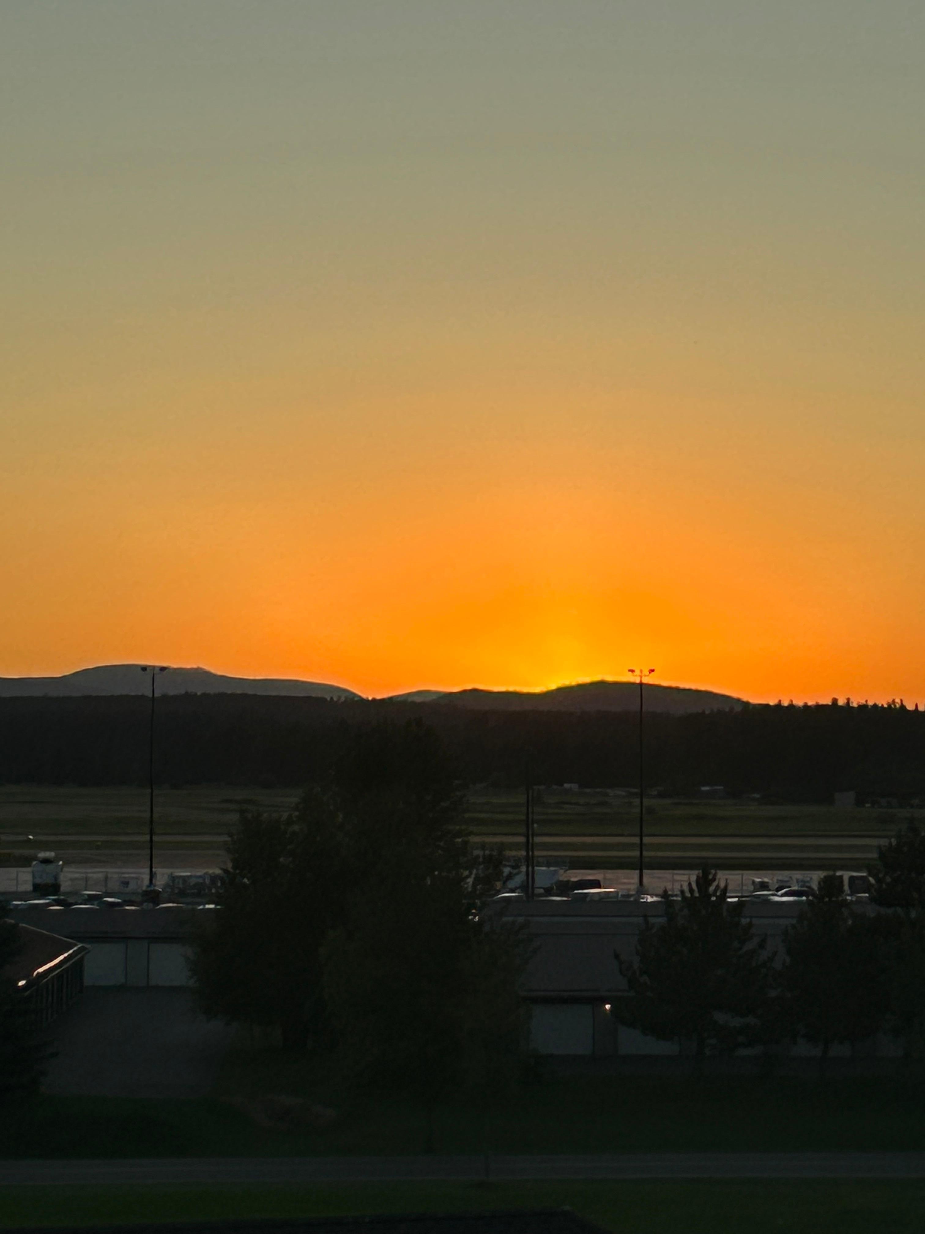 Sunset from our room facing the airport.