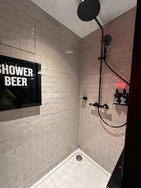 Fancy shower with a beer fridge