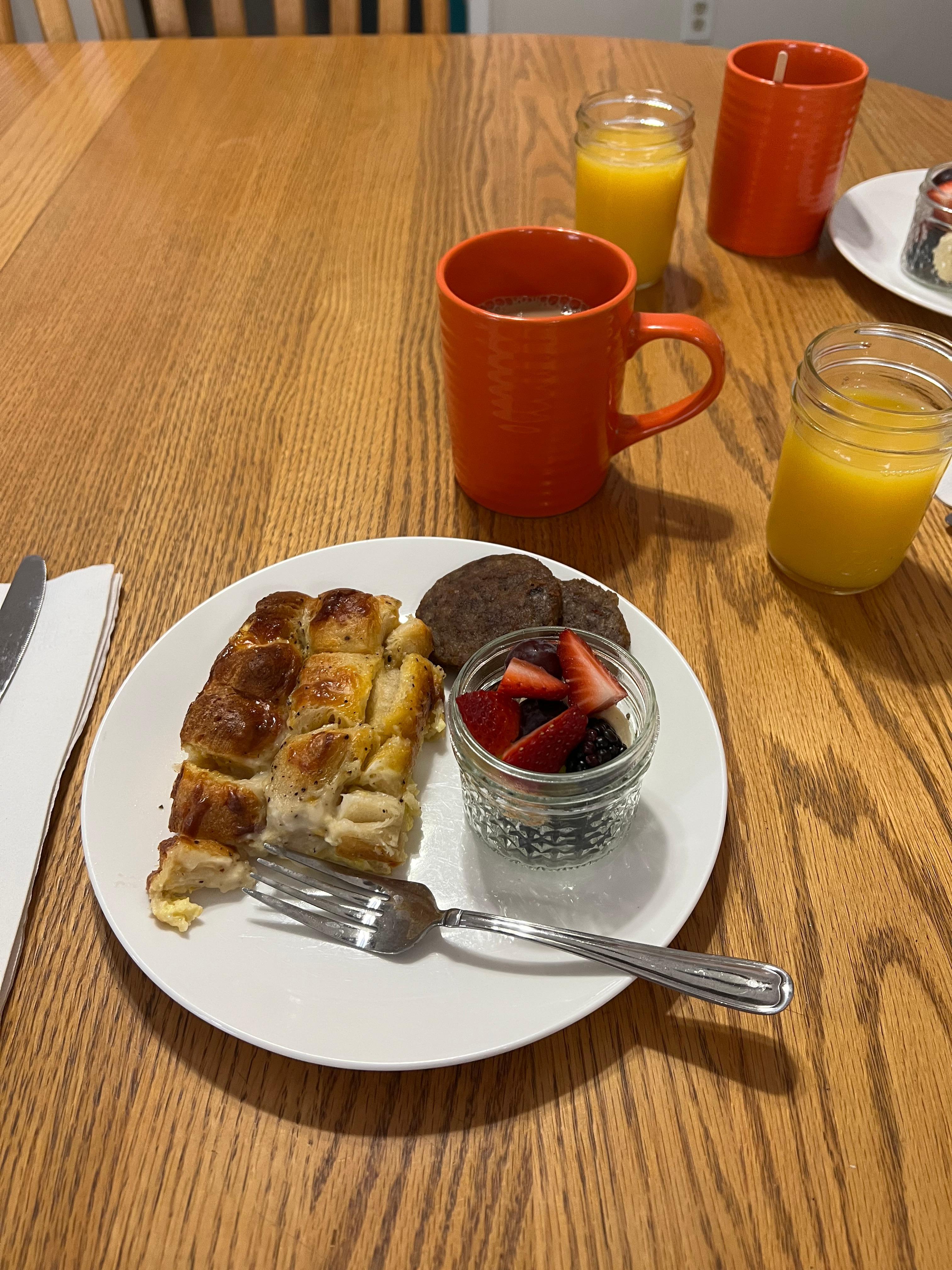 Biscuits and gravy and egg casserole with fruit and sausage. 