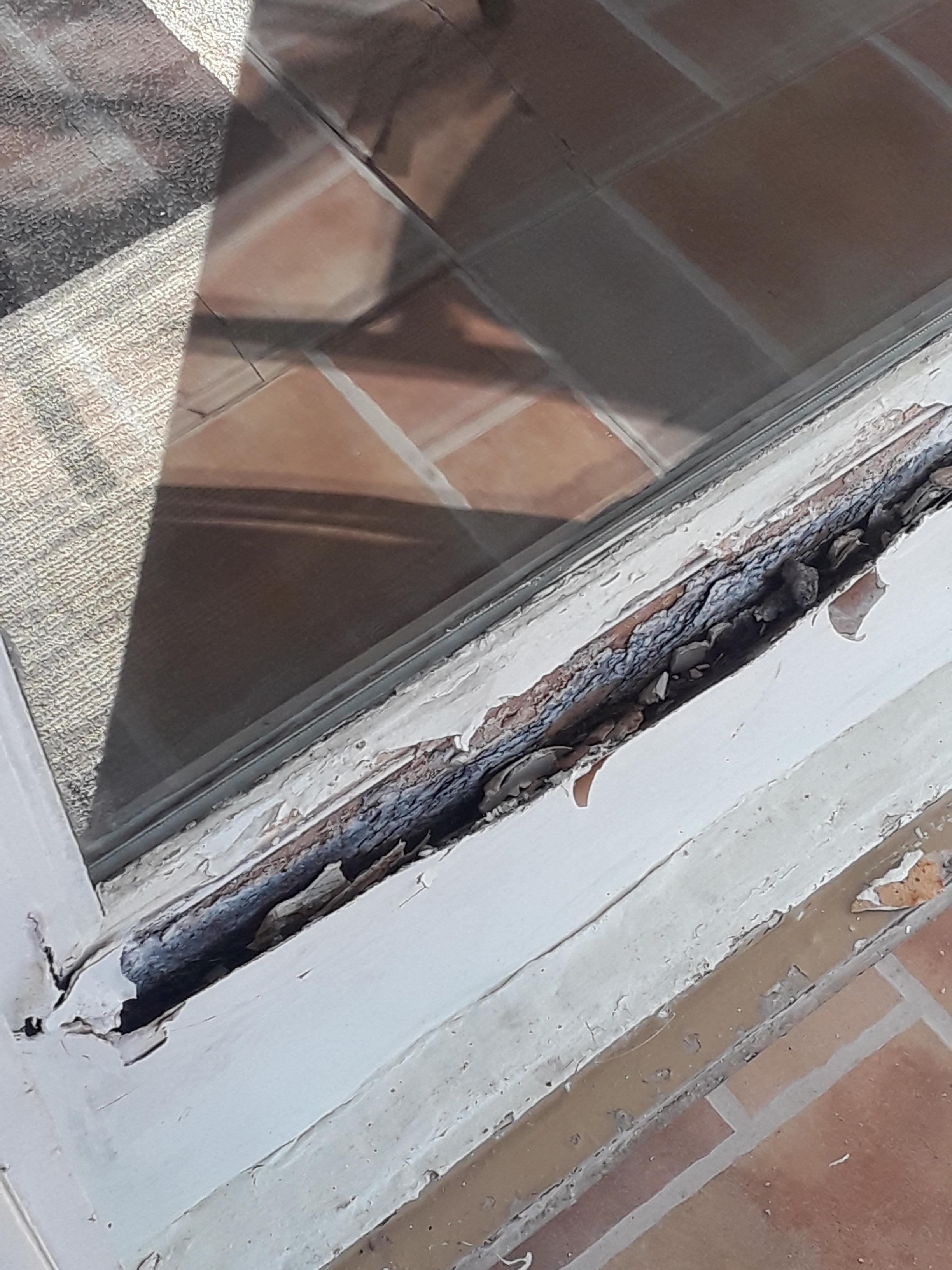 Outside balcony window.
Needs replaced or repaired.