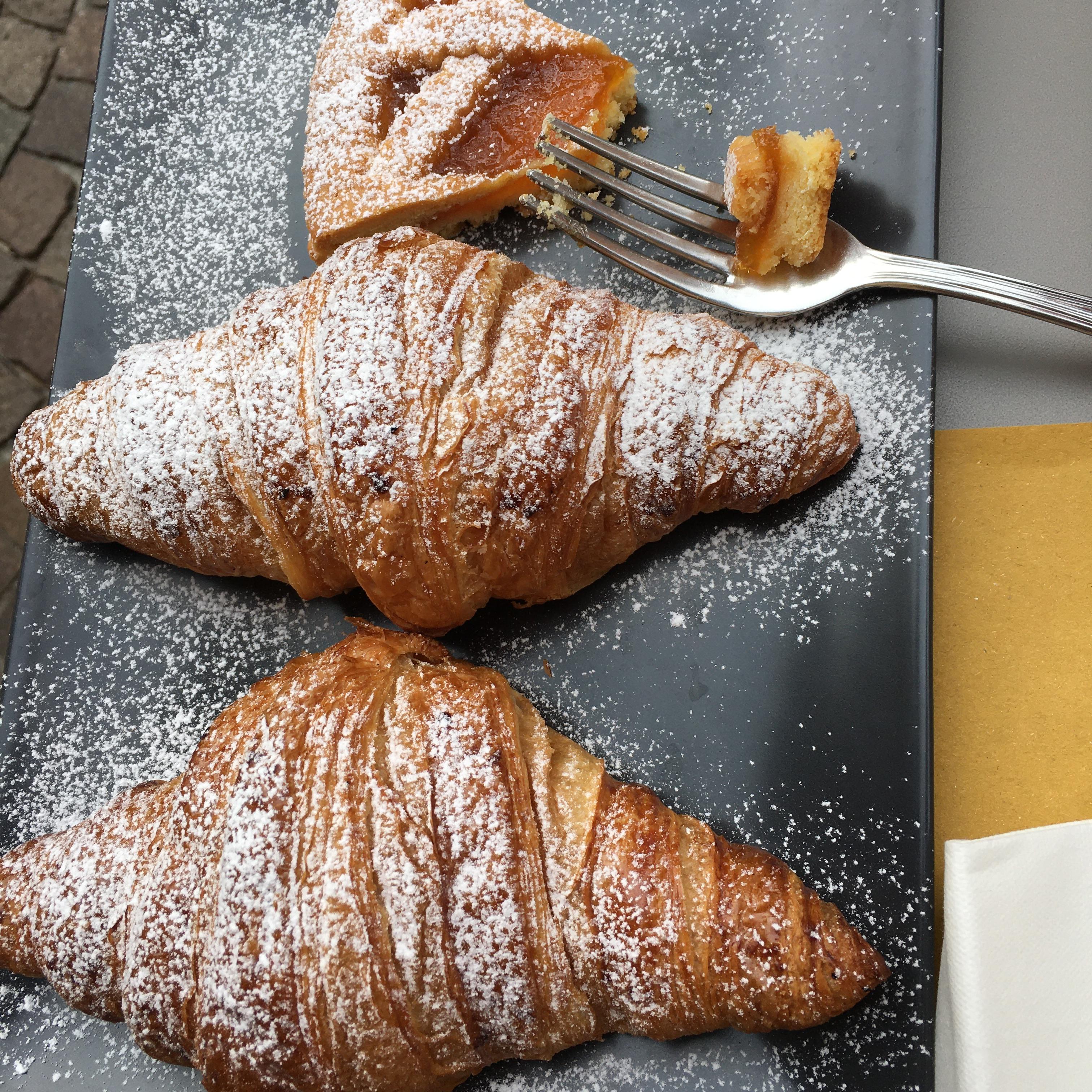 Go ahead and say yes to any carbs you’re offered in Italy. Breakfast croissants and a piece of homemade cake. 