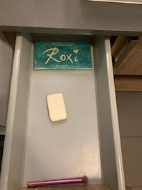 Bathroom drawer- found used eyeshadow palette, eye shadow brush and a bar soap