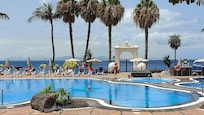 Hotel pool area with view of Fuerteventura in the distance