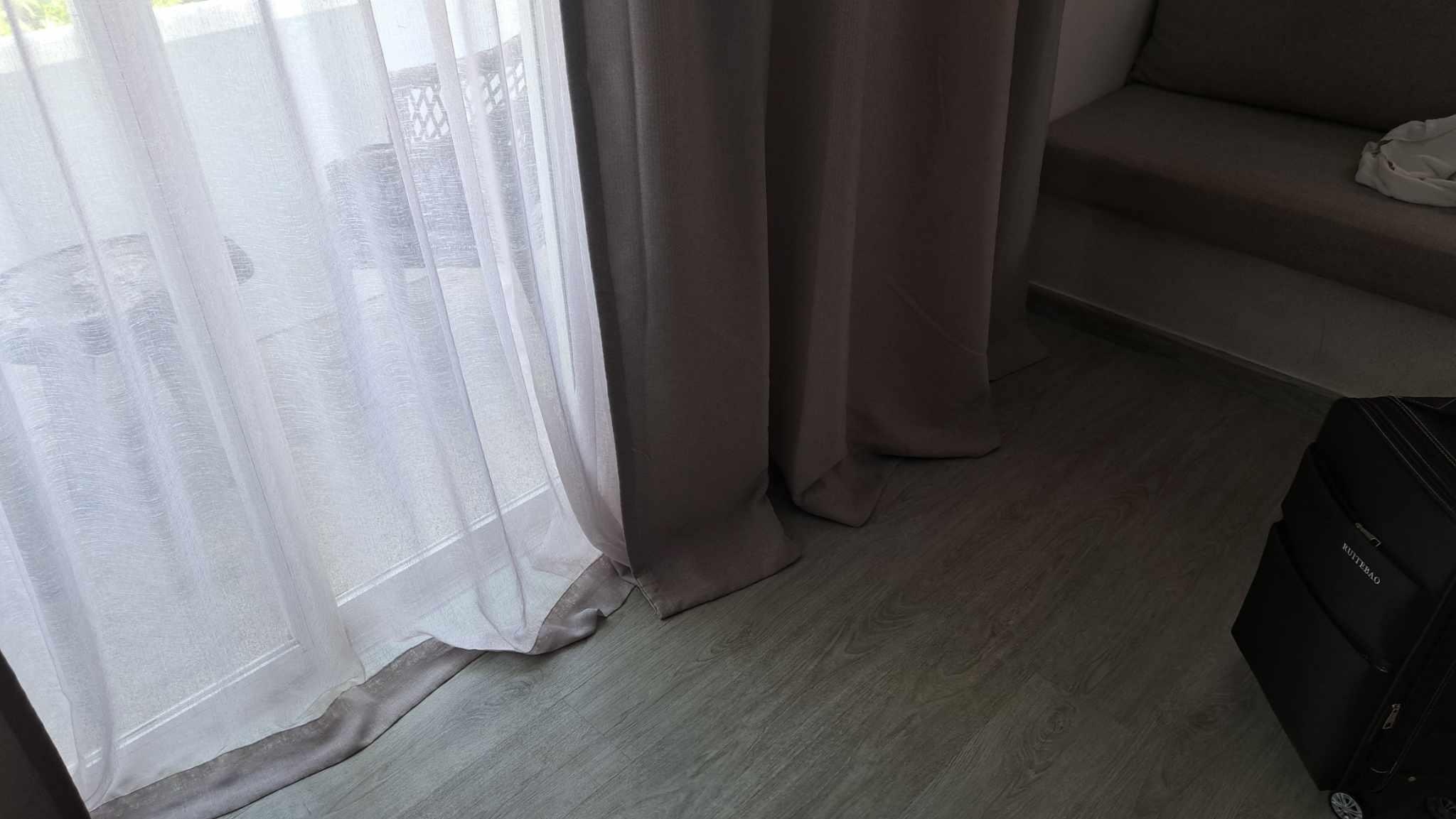 curtains touching the floor and being untidy