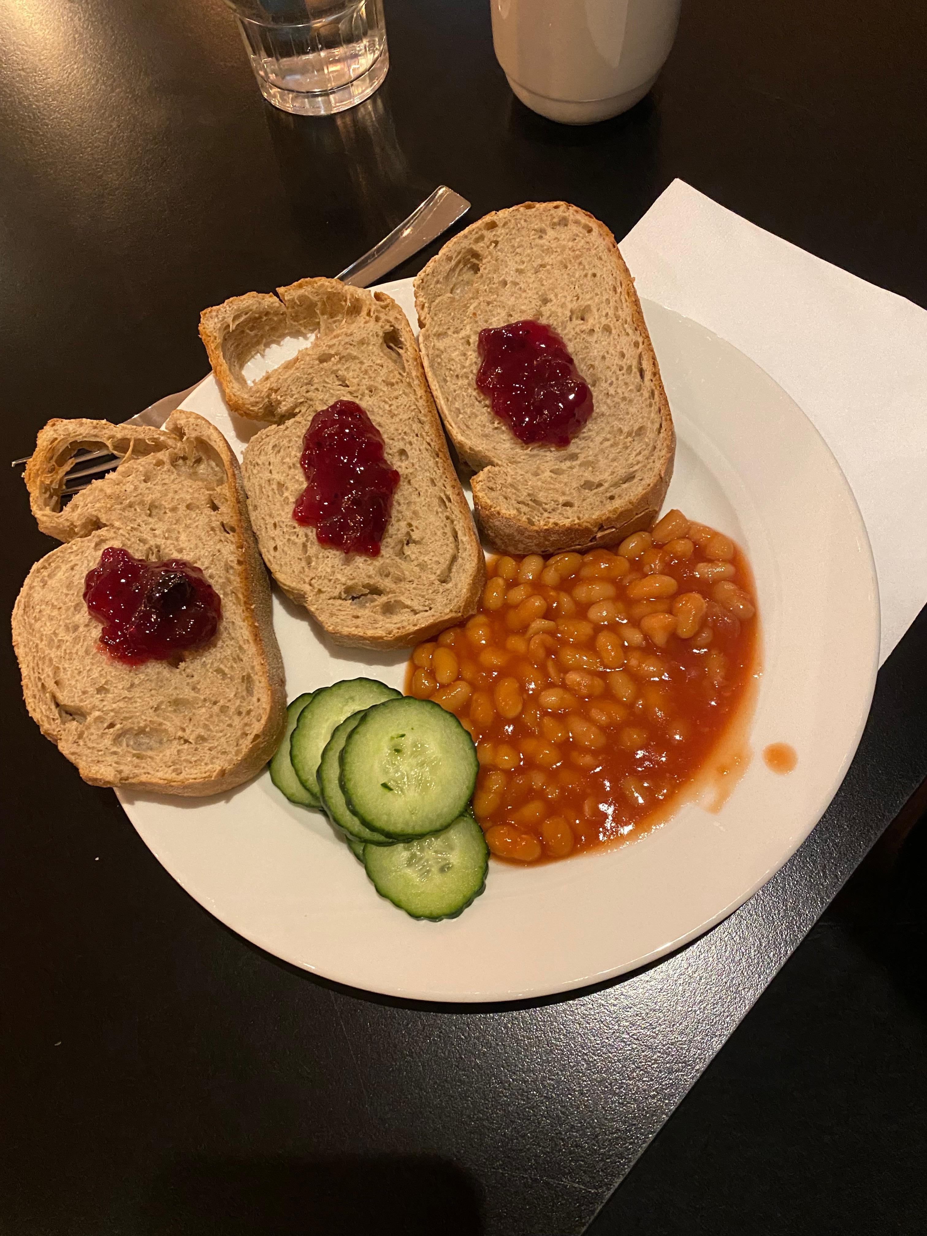 Dry bread, beans, cucumber and jam. No other warm food or vegetables were available.