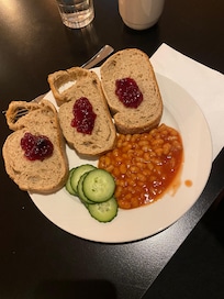 Dry bread, beans, cucumber and jam. No other warm food or vegetables were available.