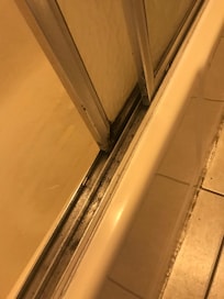 Mold in tub sliding door channel