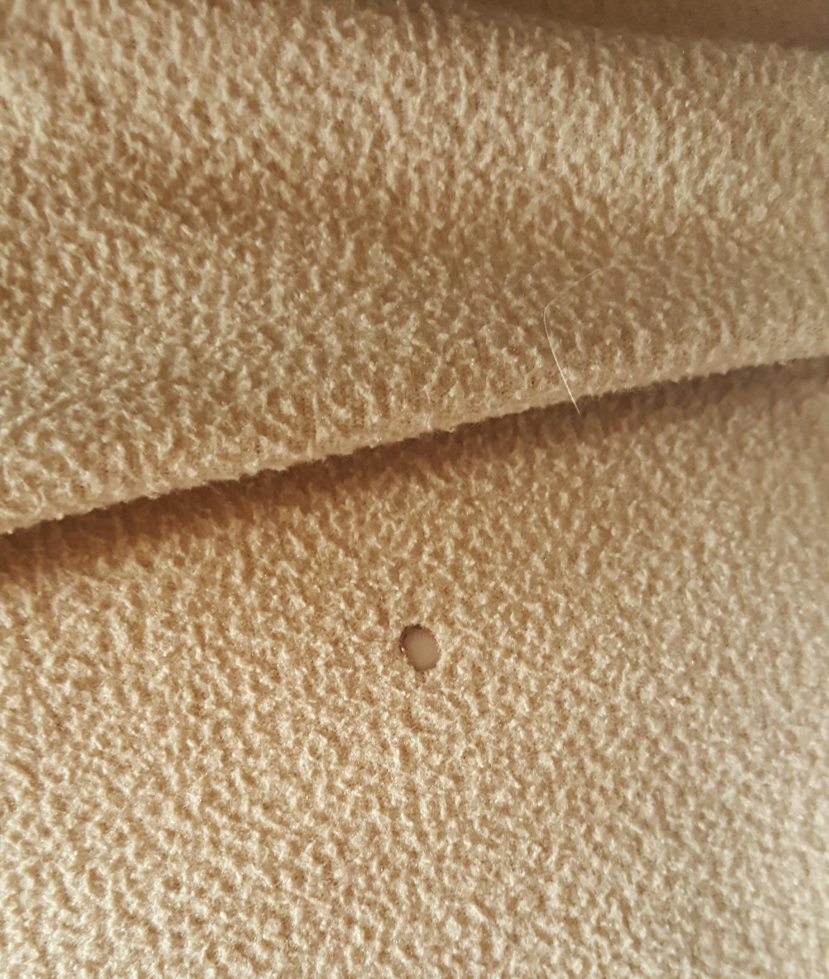 Cigarette hole in the blanket