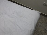 Brown stained sheets (in fairness, some might have been from the dust and smog off the street below, the windows leak like sieves)