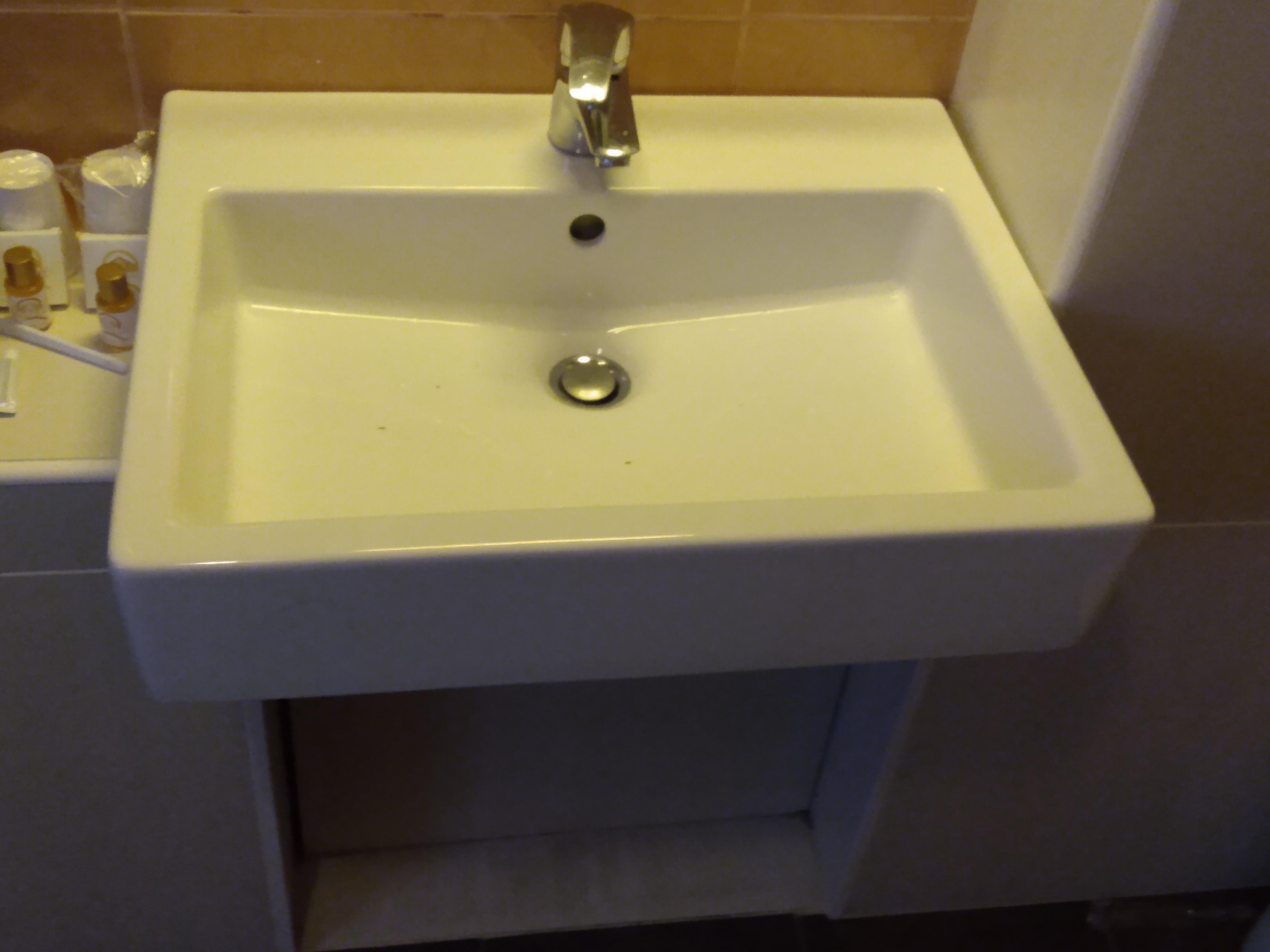 Handicapped sink lower than normal with area for wheelchair access