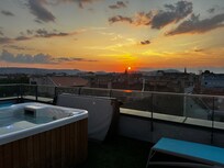 Solnedgang fra tagterrassen