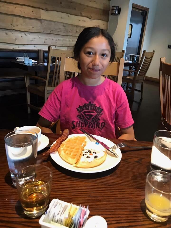My daughter enjoying delicious breakfast