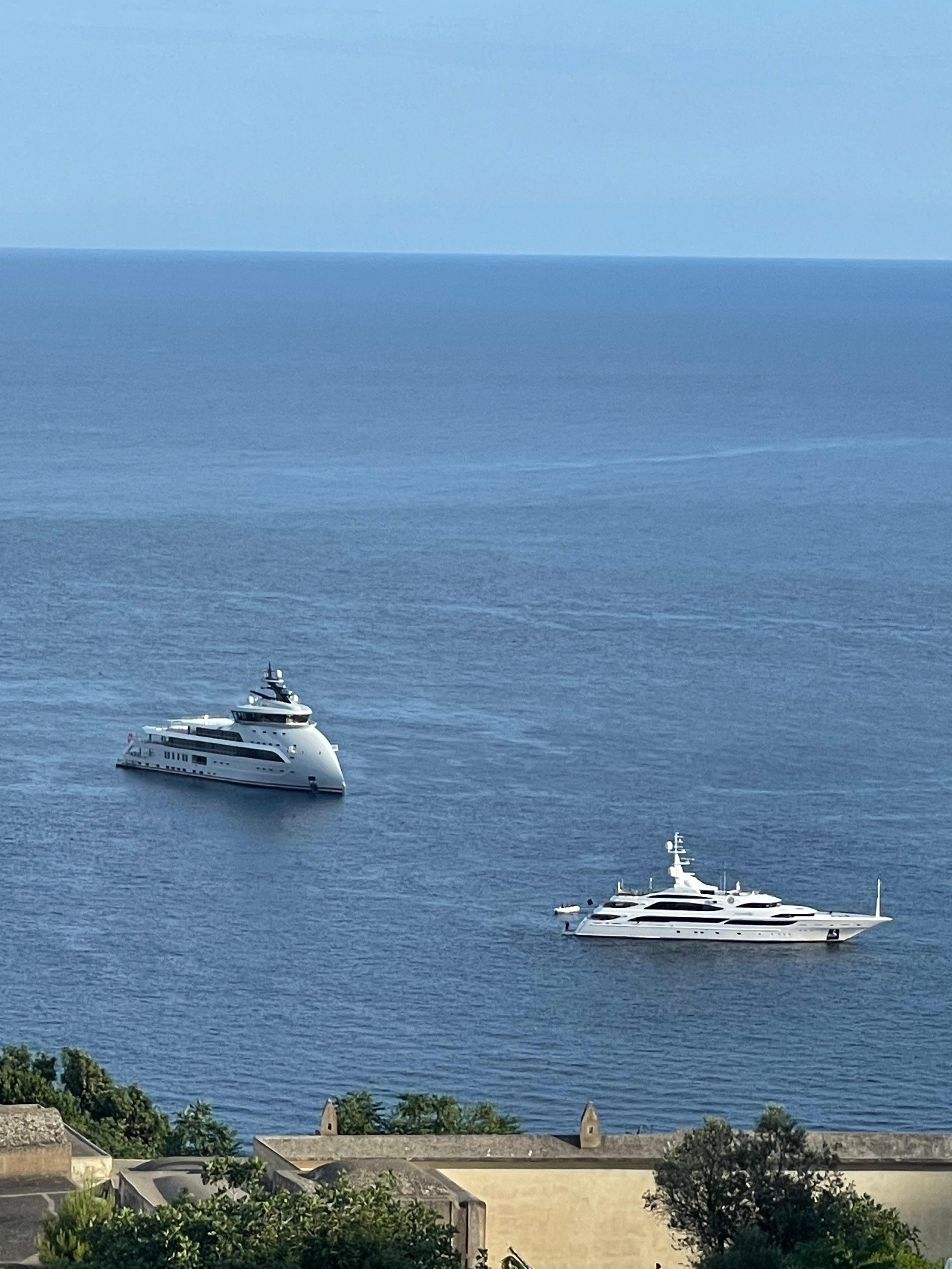 Yachts docked at harbor