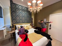 The room.  It was very pretty and a lovely chandelier over the bed.