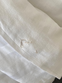 Torn bed linen