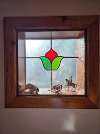 Window at the bottom of the stairs