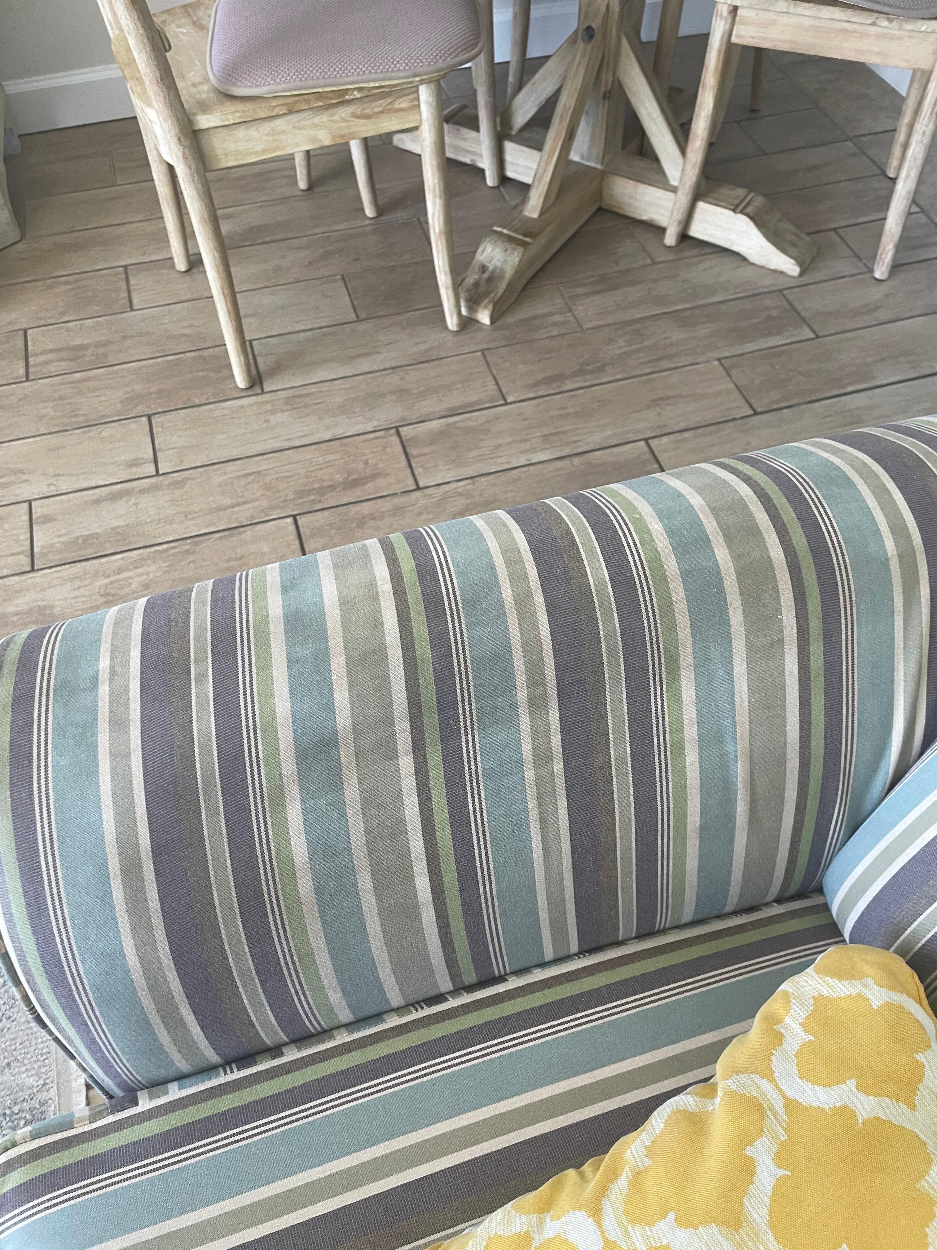 Stain on couch and hard to sit on