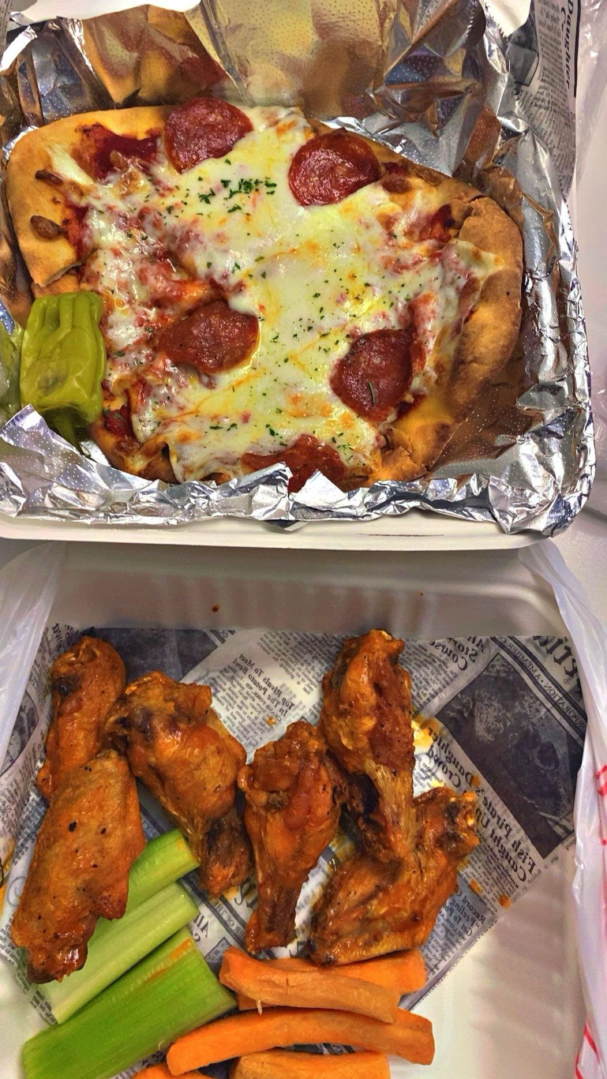 Pizza and wings from the restaurant down stairs 