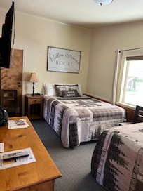 Two full sized beds with new mattress and beautiful quilts