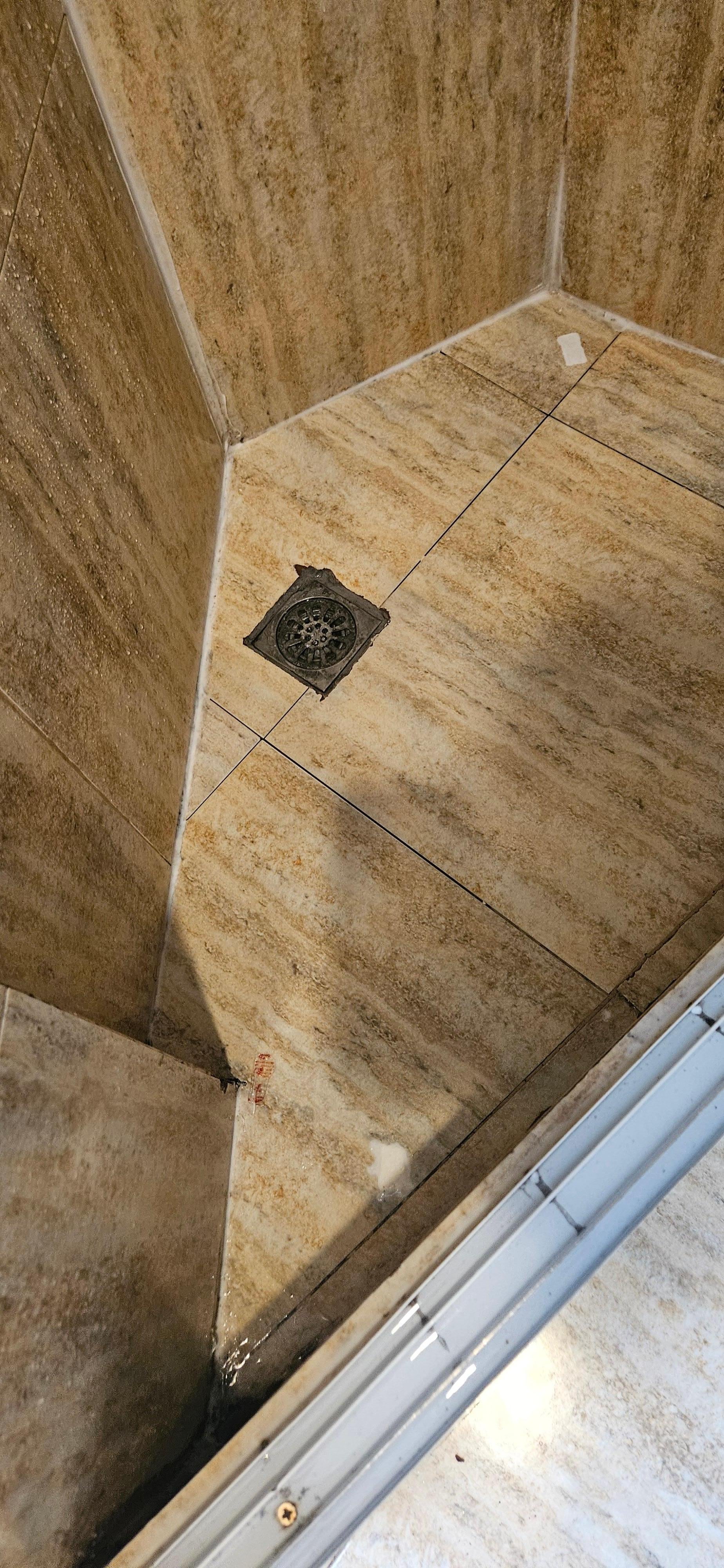 Old soap bars on shower floor