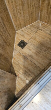 Old soap bars on shower floor