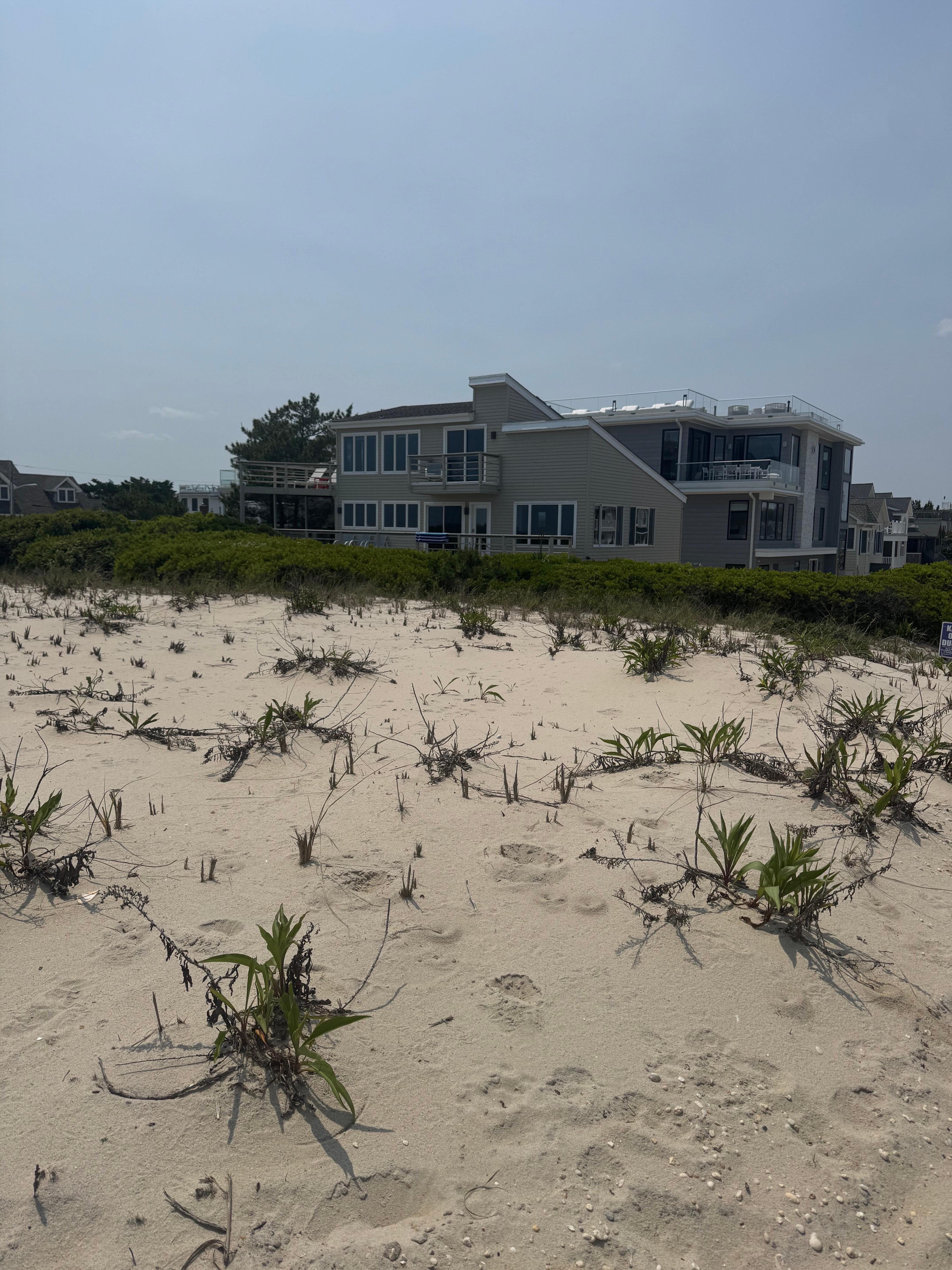 I took this picture of the house from the top of the dune, the next picture was the view from the exact same point of the beach walk. Enjoyable. :) 