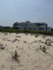 I took this picture of the house from the top of the dune, the next picture was the view from the exact same point of the beach walk. Enjoyable. :)