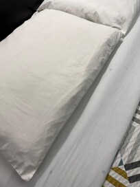 Bedsheets and pillow with stains