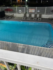 Night photo of pool.