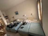 This is how they accommodate a family of four adults. It was a tiny dorm room with no where to walk.