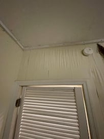 One of several walls where there is damage from water leakage.