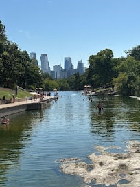 Barton Springs Pool looking into downtown Austin, a short drive from the hotel.