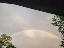 Rainbow off the back porch after rain storm.